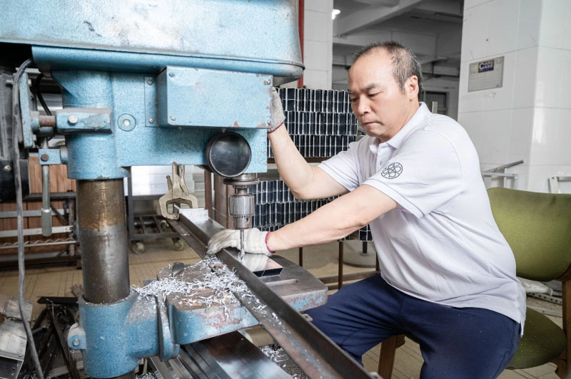 Punching holes in outdoor furniture frames
