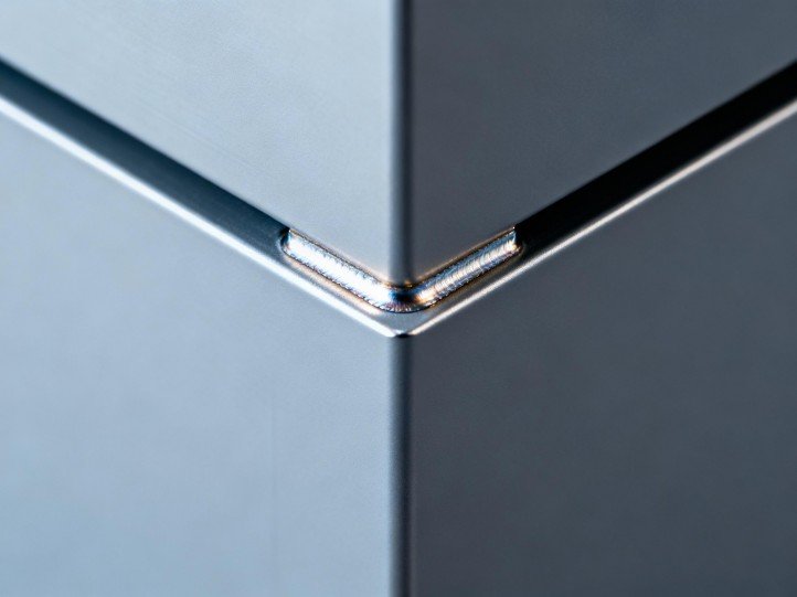 Close-up of 6063-T5 aluminum frame with sealed welds and AAMA/FGIA 2605 powder coat finish