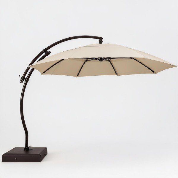 Full view of a large Offset Patio Umbrella with a curved aluminum pole and neutral beige canopy.
