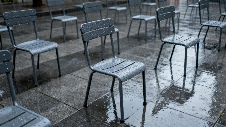 Commercial outdoor chairs on a windy plaza illustrating wind stability factors