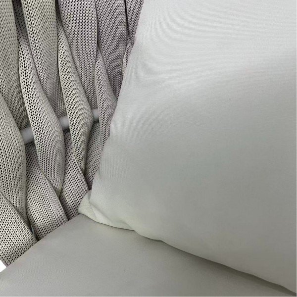 Cushion fabric close-up with hidden zipper; dense foam and water-repellent cover for easy cleaning on outdoor bar chairs.