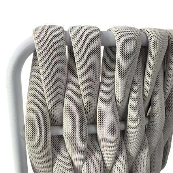 Dimensional woven-rope pattern looping over rounded top rail; breathable and UV-resistant for modern outdoor bar seating.
