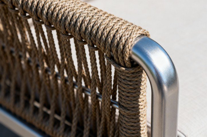 HDPE wicker weave joining a powder-coated aluminum frame, emphasizing outdoor durability.