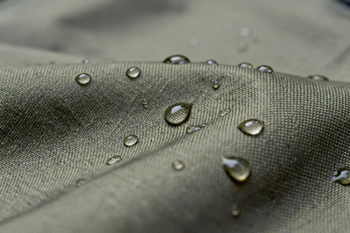 Solution-dyed outdoor fabric with waterproof coating—UV-resistant weave and durable finish close-up.